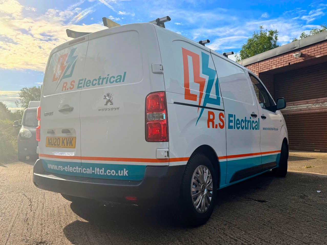The rear of a liveried RS Electrical van.